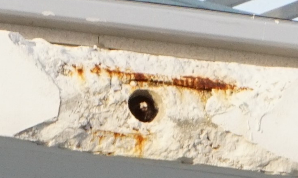 Missing grease cap in a PT Cable stressing end, and corroded reinforcing.